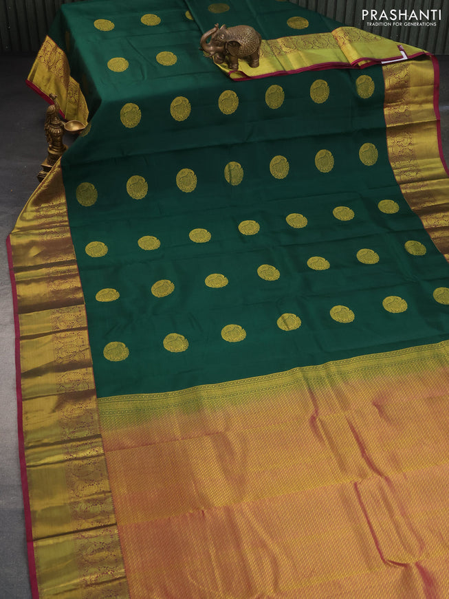 Pure kanchipuram silk saree green and magenta pink with peacock zari woven buttas and annam zari woven border