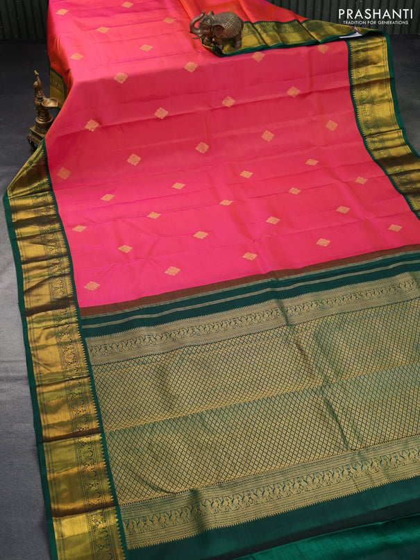 Pure kanchipuram silk saree dual shade of pinkish orange and green with zari woven buttas and zari woven korvai border