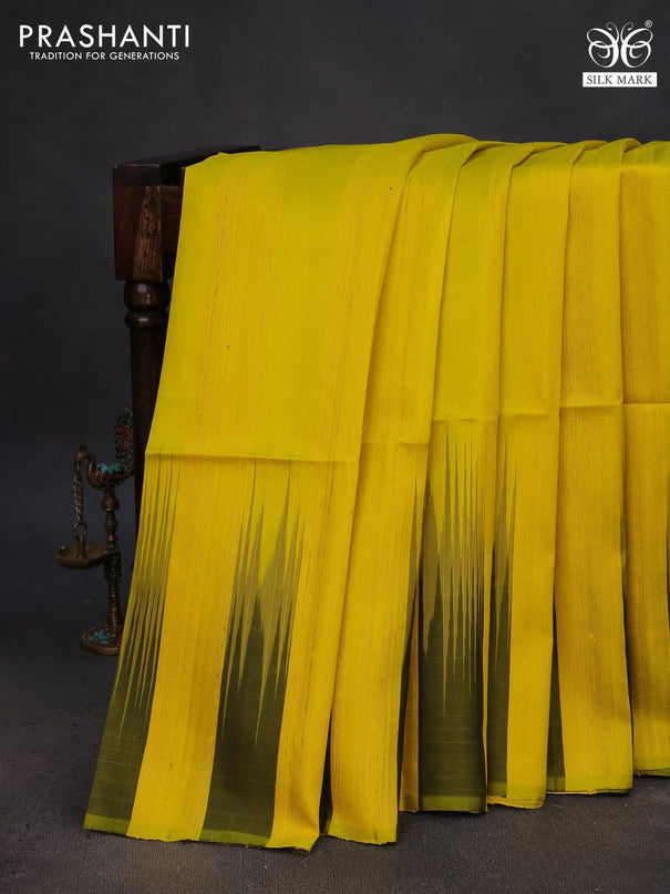 Pure soft silk saree yellow and olive green with plain body & jute finish and temple design border