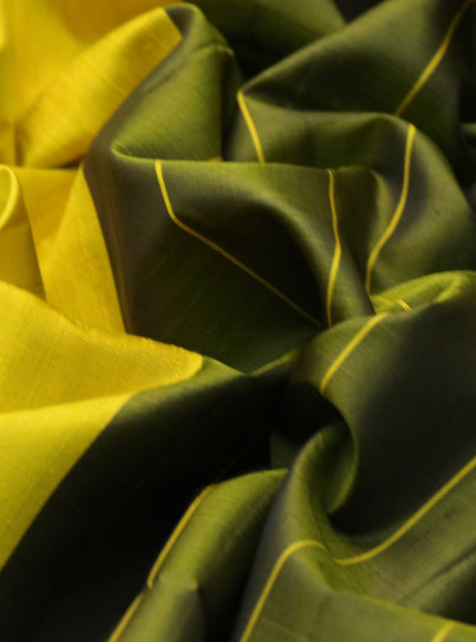 Pure soft silk saree yellow and olive green with plain body & jute finish and temple design border