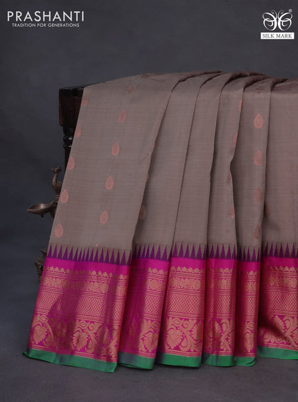 Pure gadwal silk saree brown shade and purple with zari woven buttas and temple deisgn zari woven border