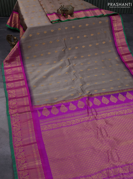 Pure gadwal silk saree brown shade and purple with zari woven buttas and temple deisgn zari woven border