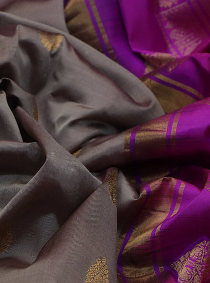 Pure gadwal silk saree brown shade and purple with zari woven buttas and temple deisgn zari woven border