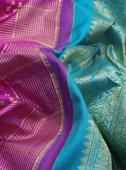 Pure gadwal silk saree purple and teal blue with allover zari weaves and long zari woven border