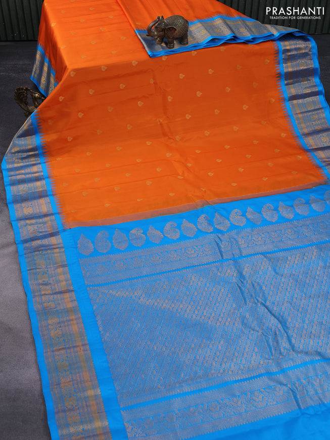 Pure gadwal silk saree orange and cs blue with zari woven buttas and temple deisgn zari woven border