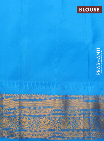 Pure gadwal silk saree orange and cs blue with zari woven buttas and temple deisgn zari woven border