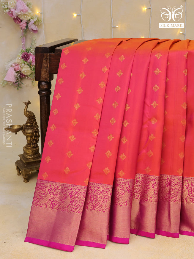 Pure kanchipuram silk saree dual shade of pinkish orange and pink with allover zari woven buttas and annam zari woven border