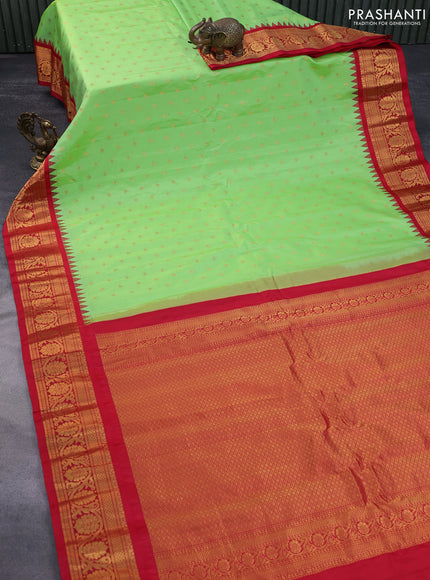 Pure gadwal silk saree light green and red with zari woven buttas and temple deisgn zari woven border