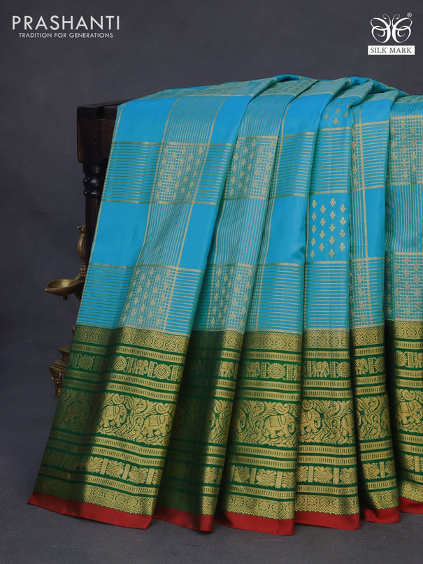 Pure gadwal silk saree light blue and green with allover zari weaves and long zari woven border