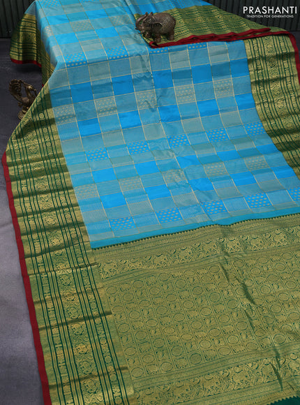 Pure gadwal silk saree light blue and green with allover zari weaves and long zari woven border