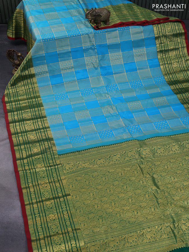 Pure gadwal silk saree light blue and green with allover zari weaves and long zari woven border