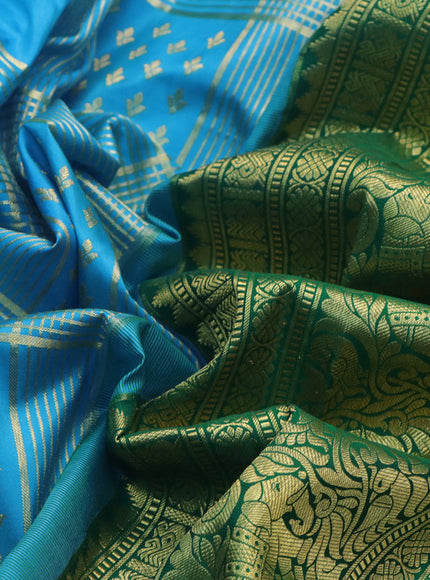 Pure gadwal silk saree light blue and green with allover zari weaves and long zari woven border