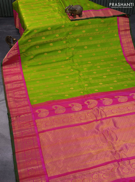 Pure gadwal silk saree green and pink with allover zari weaves & buttas and zari woven border