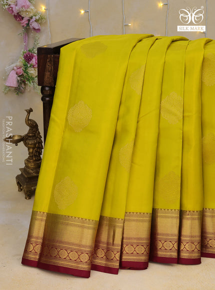 Pure kanchipuram silk saree lime yellow and dark magenta pink with zari woven buttas and zari woven border