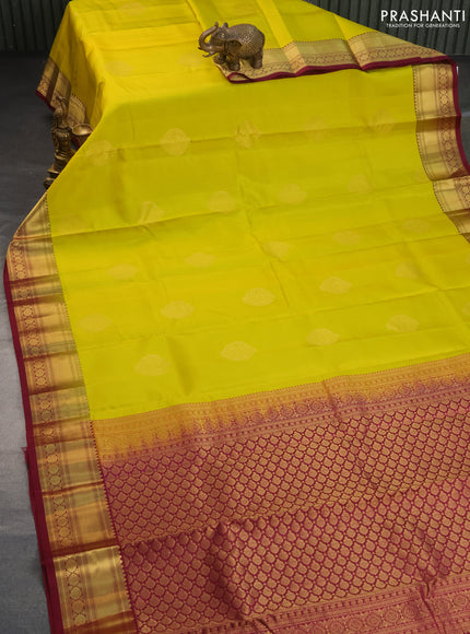 Pure kanchipuram silk saree lime yellow and dark magenta pink with zari woven buttas and zari woven border