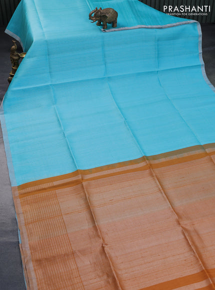 Pure raw silk saree light blue and mustard yellow with allover silver zari weaves and silver zari woven piping border