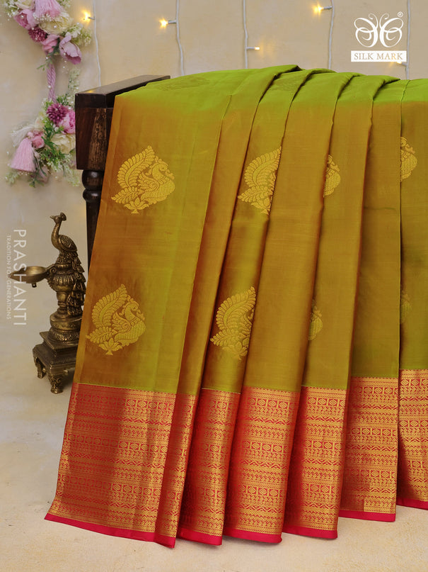 Pure kanchipuram silk saree dual shade of mehendi green and pink with zari woven annam buttas and long zari woven border