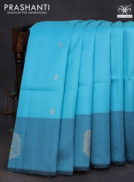 Pure raw silk saree light blue and teal blue with zari woven buttas and zari woven butta border