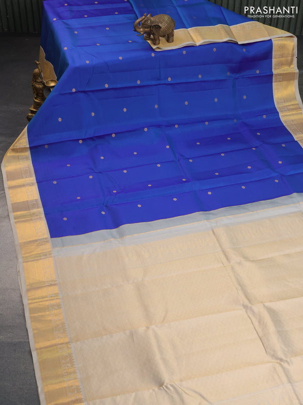 Pure kanchipuram silk saree dual shade of blue and beige with zari woven buttas and zari woven korvai border