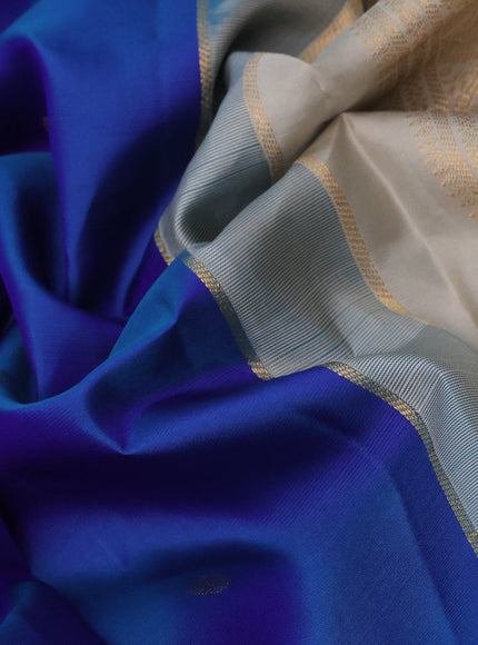 Pure kanchipuram silk saree dual shade of blue and beige with zari woven buttas and zari woven korvai border