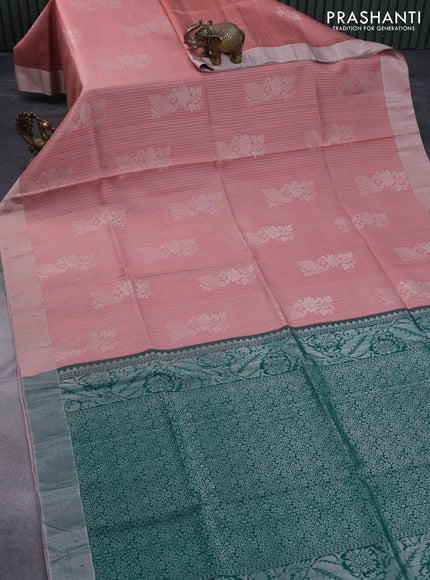 Pure raw silk saree pastel peach and green with allover silver zari weaves & buttas and silver zari woven border