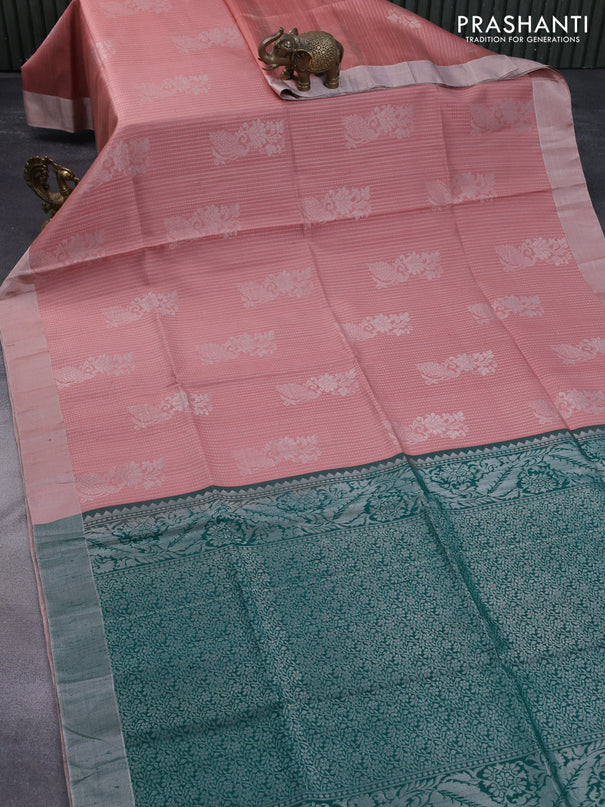 Pure raw silk saree pastel peach and green with allover silver zari weaves & buttas and silver zari woven border