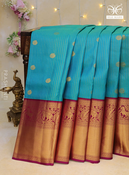 Pure kanchipuram silk saree dual shade of teal blue and purple with allover zari weaves & buttas and long zari woven korvai border