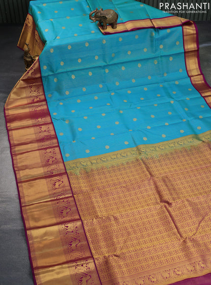 Pure kanchipuram silk saree dual shade of teal blue and purple with allover zari weaves & buttas and long zari woven korvai border