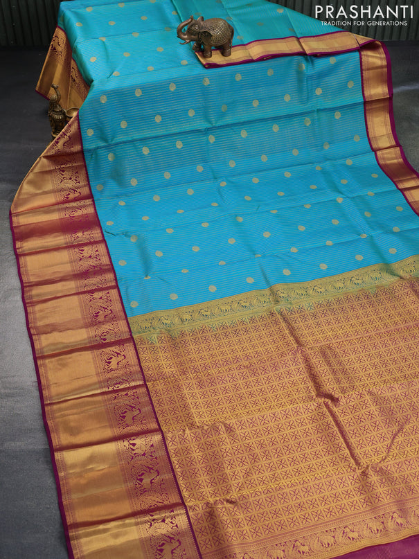 Pure kanchipuram silk saree dual shade of teal blue and purple with allover zari weaves & buttas and long zari woven korvai border