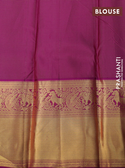 Pure kanchipuram silk saree dual shade of teal blue and purple with allover zari weaves & buttas and long zari woven korvai border