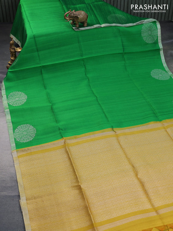 Pure raw silk saree green and mustard yellow with plain body and silver zari woven border