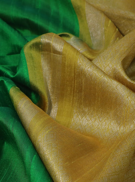 Pure raw silk saree green and mustard yellow with plain body and silver zari woven border