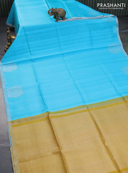 Pure raw silk saree light blue and mustard yellow with plain body and silver zari woven border