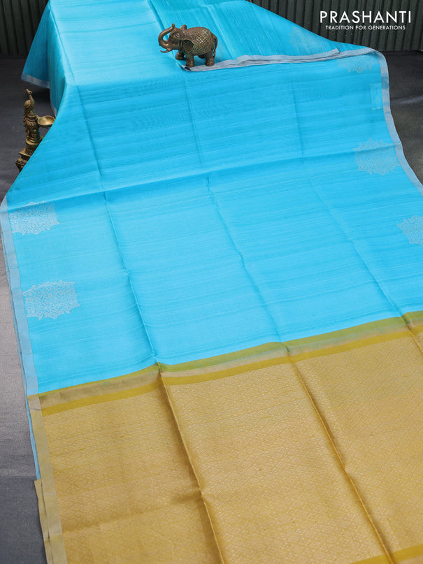 Pure raw silk saree light blue and mustard yellow with plain body and silver zari woven border