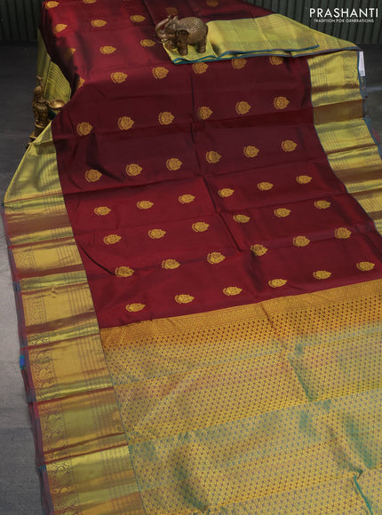 Pure kanchipuram silk saree deep maroon and dual shade of teal green with zari woven buttas and zari woven border