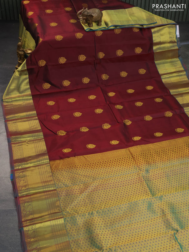 Pure kanchipuram silk saree deep maroon and dual shade of teal green with zari woven buttas and zari woven border