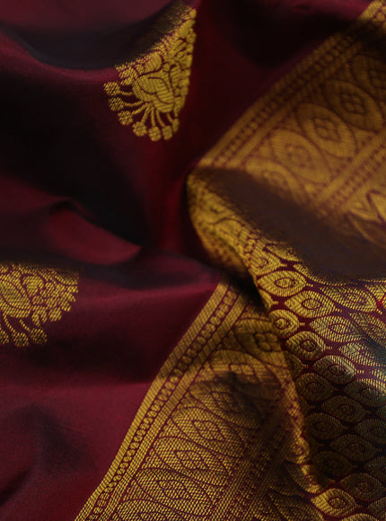 Pure kanchipuram silk saree deep maroon and dual shade of teal green with zari woven buttas and zari woven border