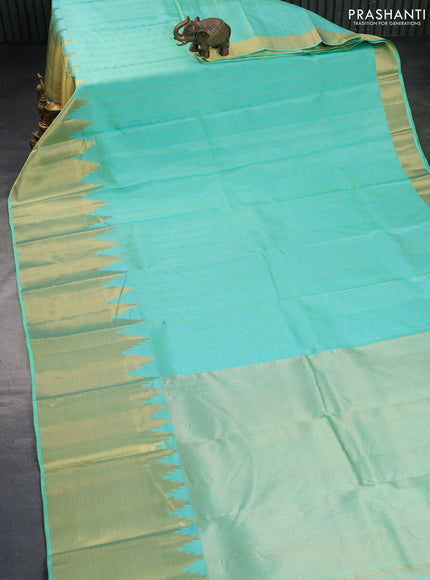 Pure kanchipuram silk saree teal blue with zari woven buttas and temple design zari woven border