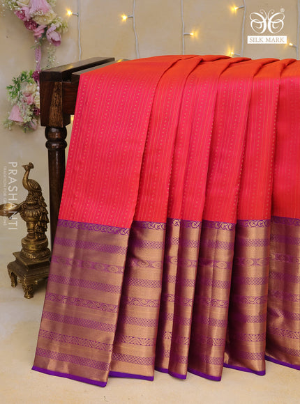 Pure kanchipuram silk saree dual shade of pinkish orange and purple with allover zari weaves and long zari woven border