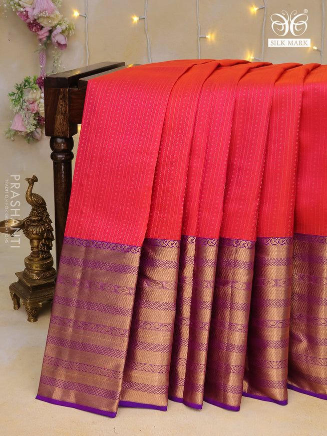 Pure kanchipuram silk saree dual shade of pinkish orange and purple with allover zari weaves and long zari woven border