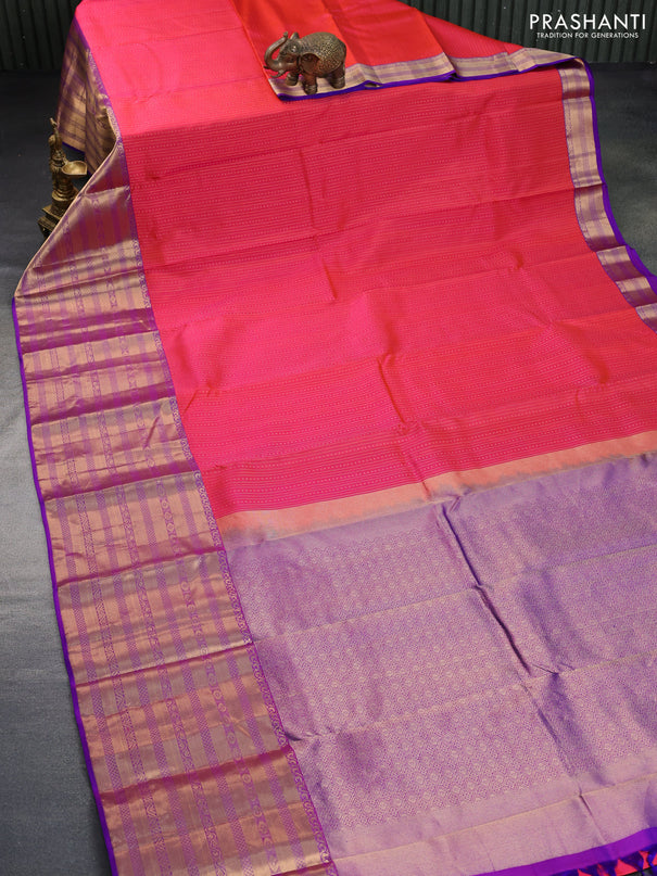 Pure kanchipuram silk saree dual shade of pinkish orange and purple with allover zari weaves and long zari woven border