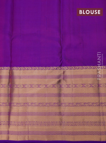 Pure kanchipuram silk saree dual shade of pinkish orange and purple with allover zari weaves and long zari woven border