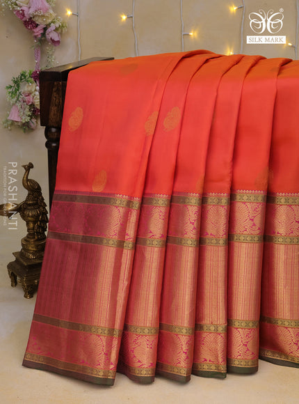 Pure kanchipuram silk saree dual shade of pinkish orange and green with zari woven buttas and long annam zari woven border