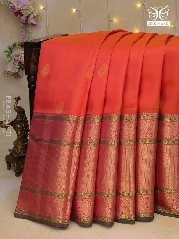 Pure kanchipuram silk saree dual shade of pinkish orange and green with zari woven buttas and long annam zari woven border