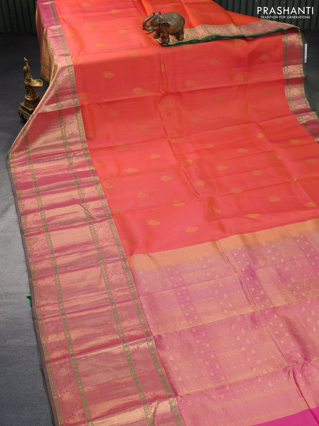 Pure kanchipuram silk saree dual shade of pinkish orange and green with zari woven buttas and long annam zari woven border