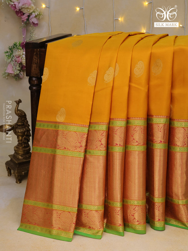 Pure kanchipuram silk saree mustard yellow and green with zari woven buttas and long annam zari woven border