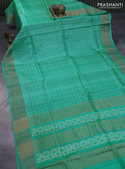 Pure tussar silk saree teal blue with allover geometric prints and zari woven border