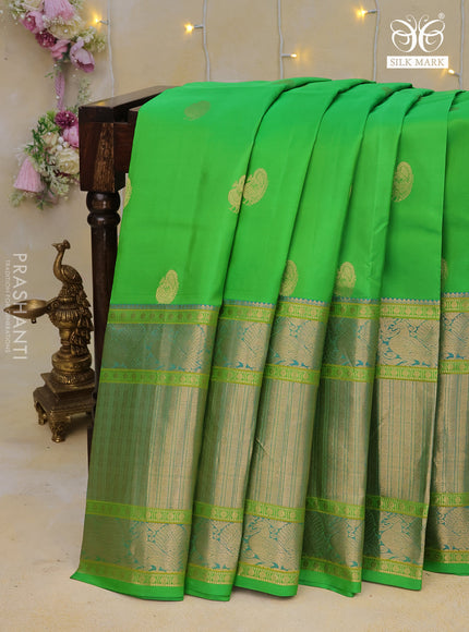 Pure kanchipuram silk saree parrot green and dual shade of cs blue with zari woven annam buttas and long annam zari woven border