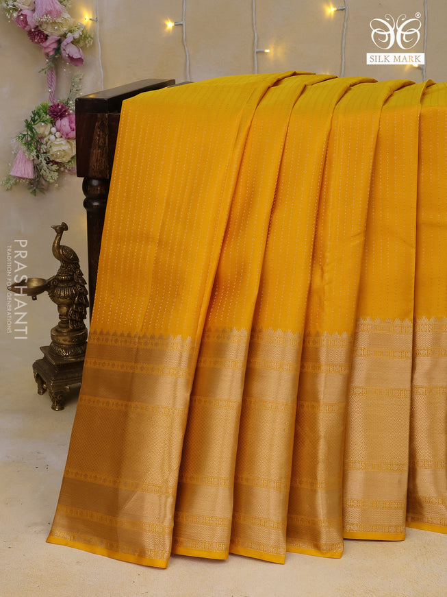 Pure kanchipuram silk saree yellow with allover zari weaves and long zari woven border