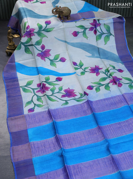 Pure tussar silk saree off white cs blue and blue with floral hand painted prints and zari woven border